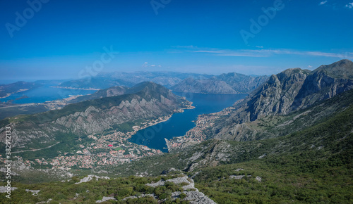Panorama of the beautiful Kotor bay, viewed from the Lovcen national park in Montenegro on a sunny almost cloud-less day. Visible Kotor, Tivat, sea and distant mountains