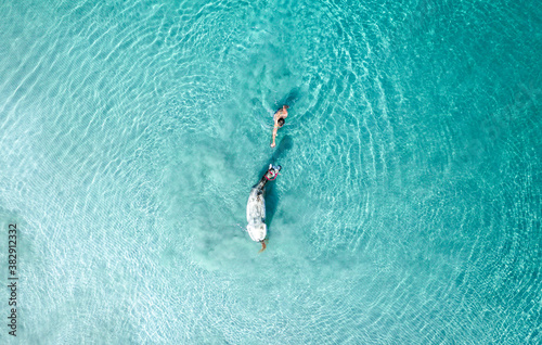 Aerial View Of Person Swimming With Horse In The Ocean, Colombia