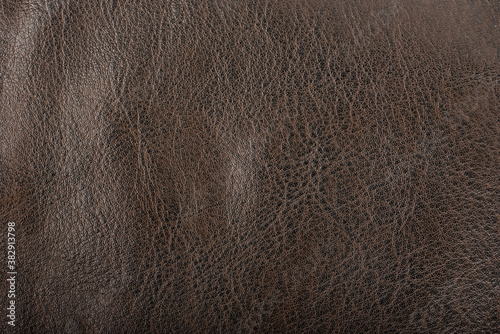 Brown leather surface as background. Macro shot.