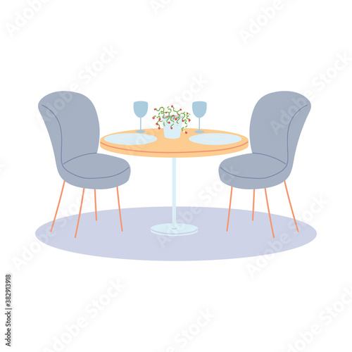 restaurant table and two chairs, with plates and glasses