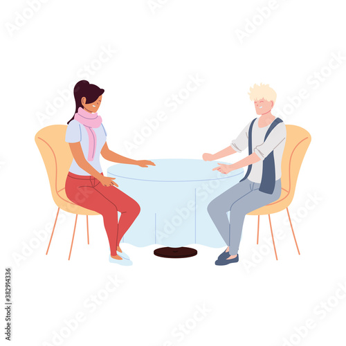 couple in love smiling and talking in restaurant