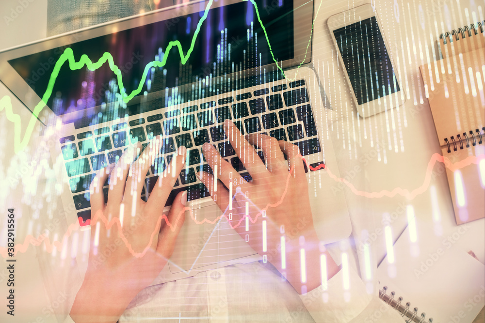 Double exposure of woman hands working on computer and forex chart hologram drawing. Top View. Financial analysis concept. Double exposure of woman hands working on computer and forex chart hologram drawing. Top View. Financial analysis concept.