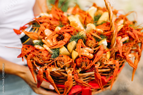 Festive woven gift basket for a man with crayfish and lemons