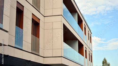 Estate property and condo architecture. Fragment of modern residential flat with apartment building exterior. Detail of new luxury home complex. 