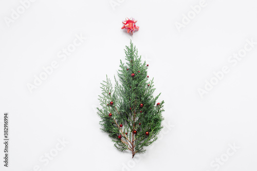 Christmas tree on white background. Trendy minimal New Year concept. Flat lay  top view  copy space.