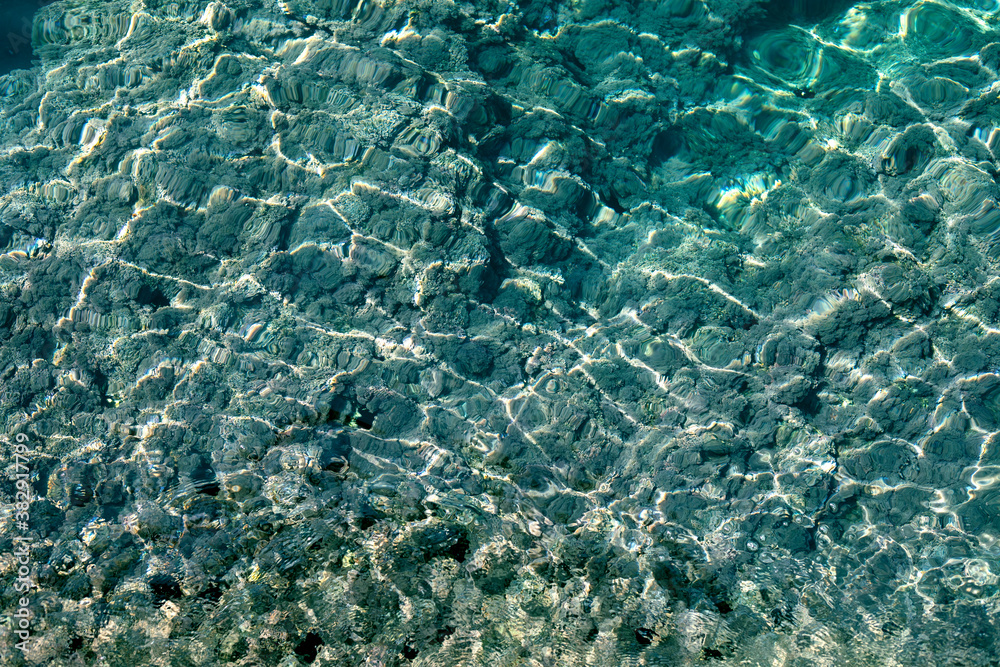 Aegean sea with algae top view, blurred background, natural, vertical