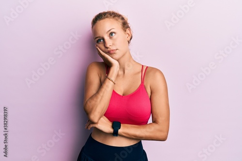 Fototapeta Naklejka Na Ścianę i Meble -  Beautiful caucasian woman wearing sportswear thinking looking tired and bored with depression problems with crossed arms.