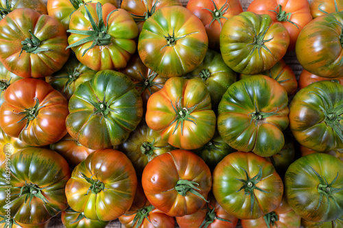 Delicious tomatoes in Summer tray market agriculture farm full of organic. Fresh tomatoes, It can be used as background