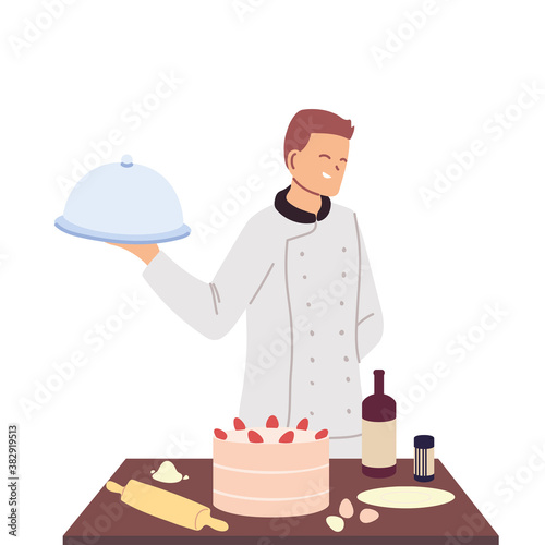 young pastry chef with work table and tray