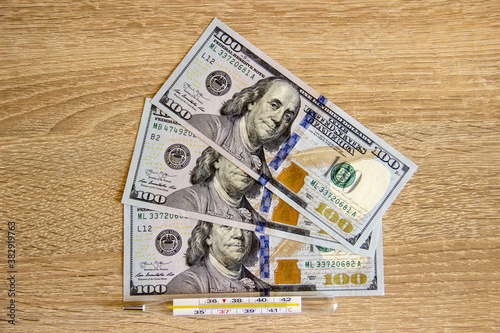 Money dollars lie on the table in the office.