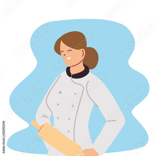 young woman chef professional with roller
