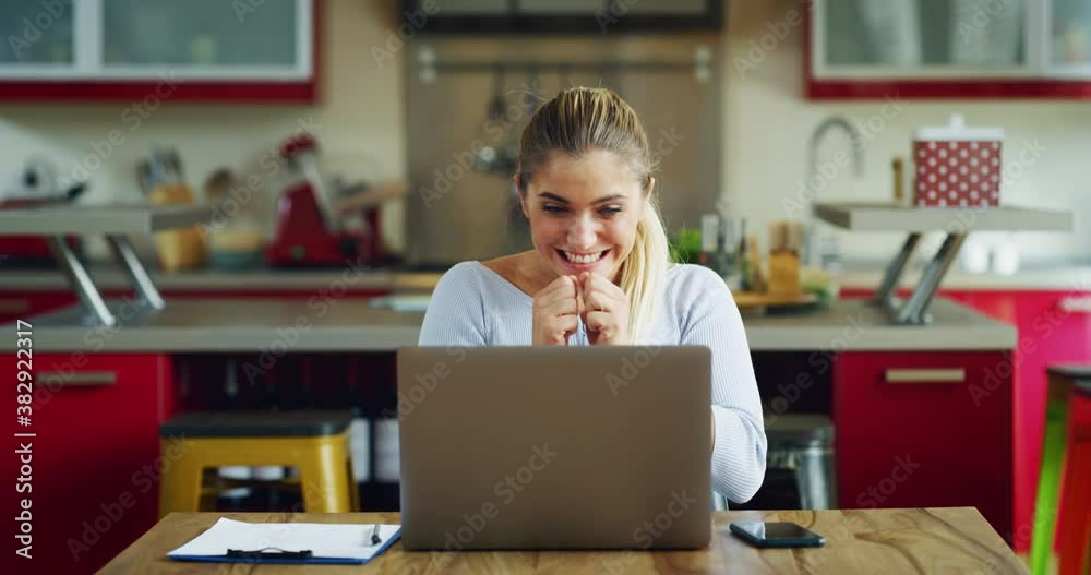 Authentic shot of young successful businesswoman is controlling emails on laptop while working from home and exulting and celebrating a successful seal or promotion in her career. Authentic shot of young successful businesswoman is controlling emails on laptop while working from home and exulting and celebrating a successful seal or promotion in her career.
