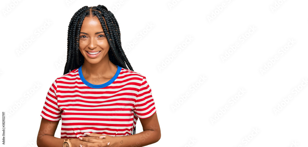 Beautiful hispanic woman wearing casual clothes with hands together and crossed fingers smiling relaxed and cheerful. success and optimistic