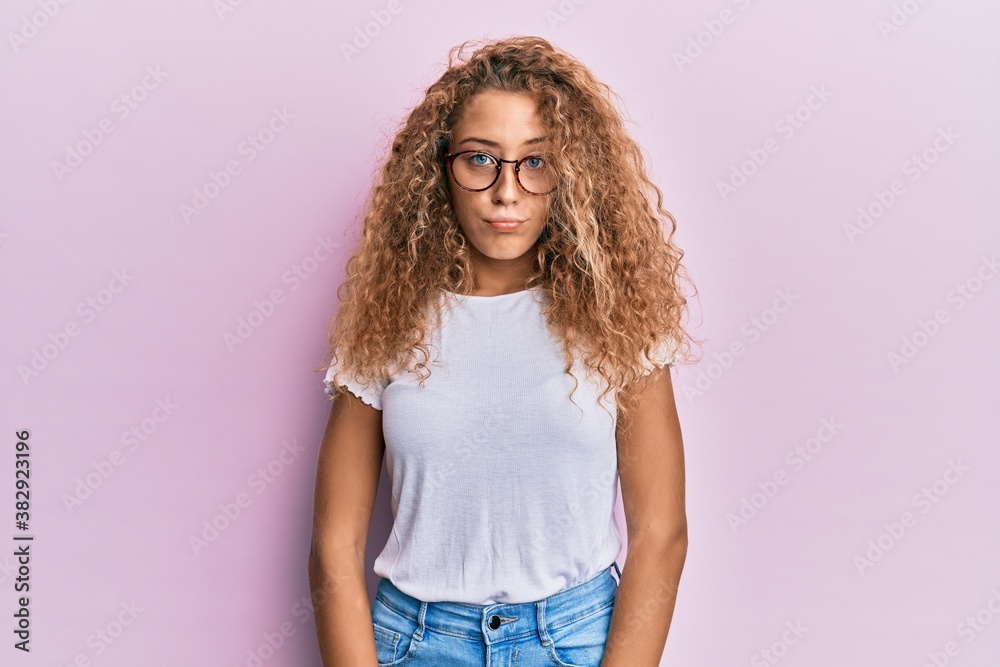 Beautiful caucasian teenager girl wearing white t-shirt over pink background depressed and worry for distress, crying angry and afraid. sad expression. Beautiful caucasian teenager girl wearing white t-shirt over pink background depressed and worry for distress, crying angry and afraid. sad expression.