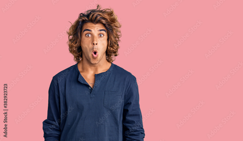 Young hispanic man wearing casual clothes afraid and shocked with surprise expression, fear and excited face. Young hispanic man wearing casual clothes afraid and shocked with surprise expression, fear and excited face.