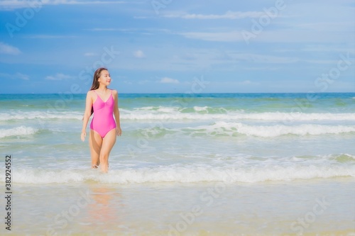 Portrait beautiful young asian woman relax smile around beach sea ocean