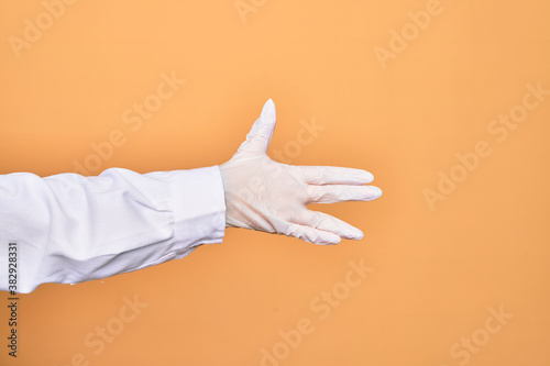 Quadro em tela Hand of a person wearing medical surgical glove doing Star Trek salutation over