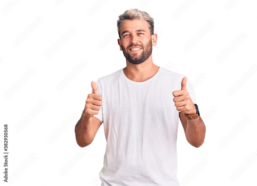 Young handsome blond man wearing casual t-shirt crazy and mad shouting and yelling with aggressive expression and arms raised. frustration concept. Young handsome blond man wearing casual t-shirt crazy and mad shouting and yelling with aggressive expression and arms raised. frustration concept.