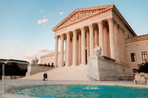 A couple walks by the US Supreme Court photo