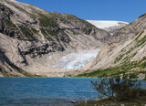 View From The Lake Nigardsbrevatnet To The Glacier Nigardsbreen In Jostedalsbreen National Park On A Sunny Summer Day With A Clear Blue Sky