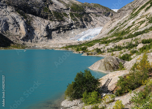 View From The Lake Nigardsbrevatnet To The Glacier Nigardsbreen In Jostedalsbreen National Park On A Sunny Summer Day With A Clear Blue Sky photo