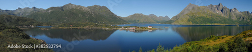 Panorama View To A Little Chapel On A Headland In Sildpollen Near Vestpollen On Lofoten Islands At Eidsfjord On A Sunny Summer Day With A Clear Blue Sky
