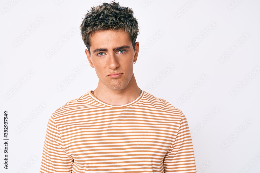 Young handsome man wearing casual clothes depressed and worry for distress, crying angry and afraid. sad expression. Young handsome man wearing casual clothes depressed and worry for distress, crying angry and afraid. sad expression.