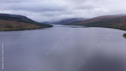 shot of loch arkaig in the argyll region of the highlands of scotland during autumn on a clear bright day showing calm waters on the inland loch photo