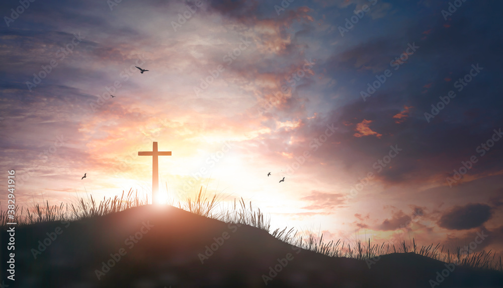 Thanksgiving concept: Religious cross silhouette against a bight sunrise sky