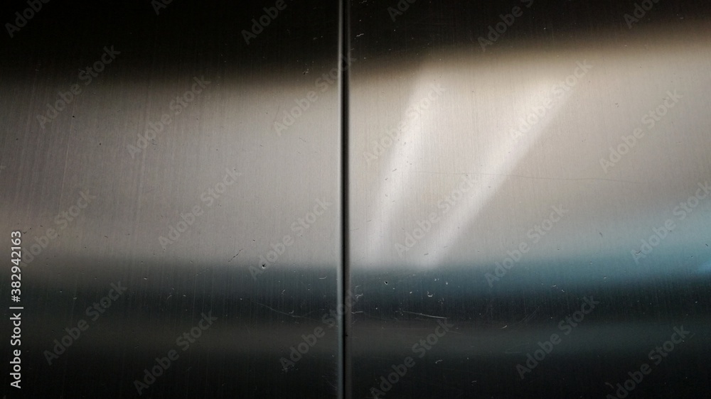 Fototapeta premium spotlight on wall,Light reflected through shiny stainless steel surface