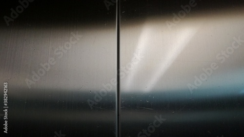 spotlight on wall,Light reflected through shiny stainless steel surface