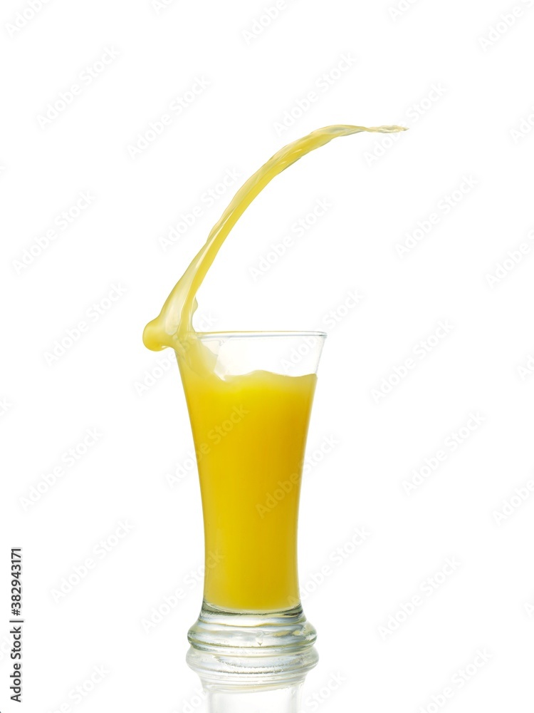 splashing orange juice with oranges isolated on white splashing orange juice with oranges isolated on white