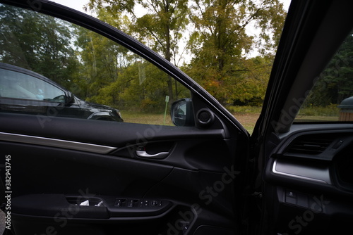 view of a car door with nature background © Ernest