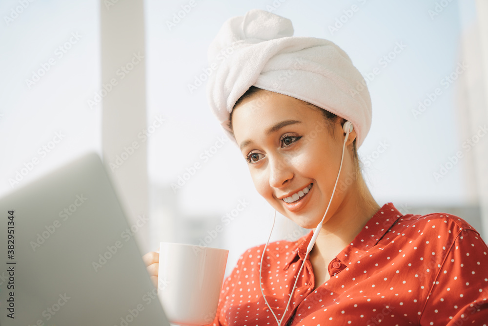 Beautiful woman working on laptop in the morning. Beautiful woman working on laptop in the morning.