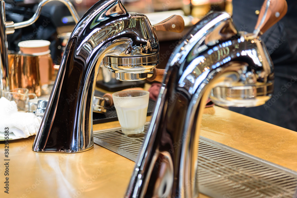 Fototapeta premium Closeup to Coffee making machine in the counter bar in coffee cafe
