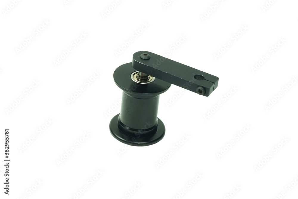 Close-up vertical view of an aluminum Film transport roller 35mm with arm of Motion picture film productions . Close-up vertical view of an aluminum Film transport roller 35mm with arm of Motion picture film productions .
