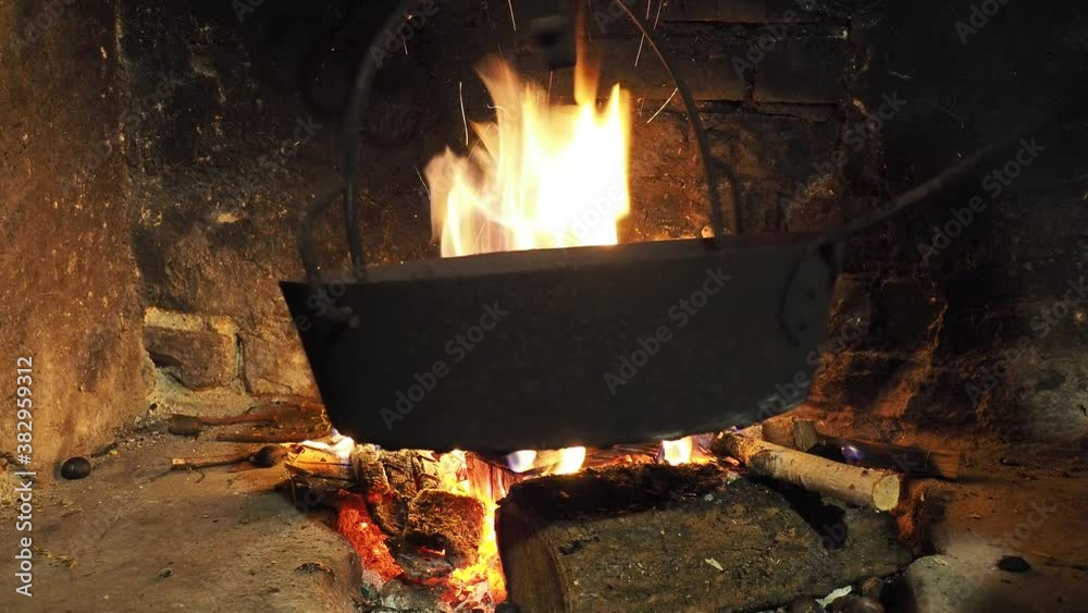 Cooking roasted chestnuts in the pan on fire. Fall season. Home made food Cooking roasted chestnuts in the pan on fire. Fall season. Home made food