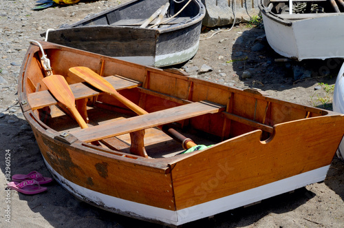 Traditional wooden rowboat with oars on Mohegan Island in coastal Maine. photo