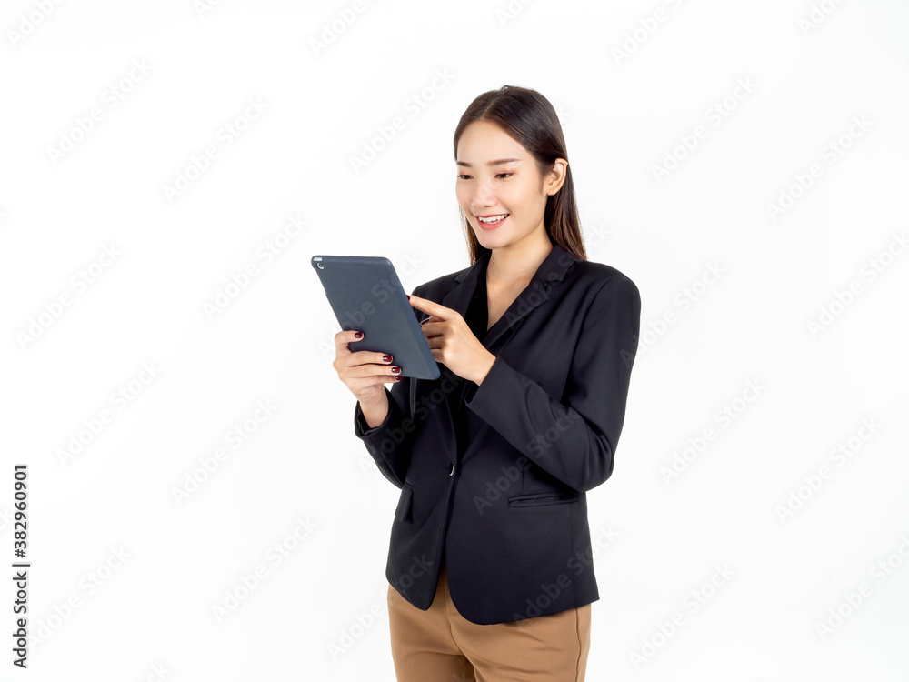 Portrait of young beauty Asian Businesswoman in black suit holding and using tablet. Portrait of young beauty Asian Businesswoman in black suit holding and using tablet.