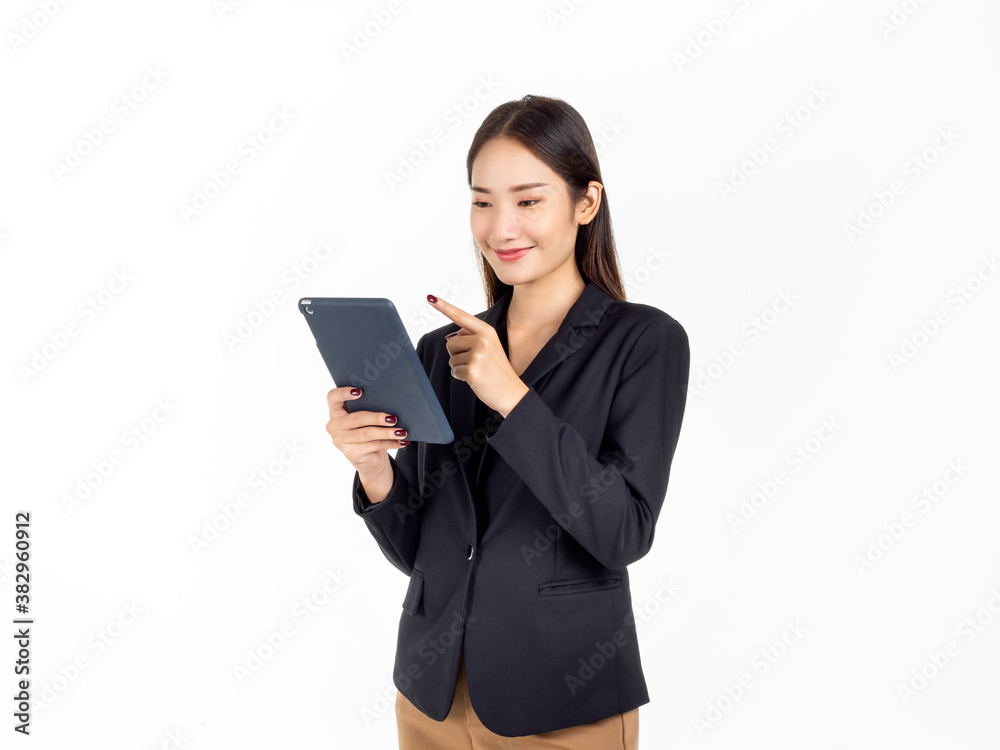 Portrait of young beauty Asian Businesswoman in black suit holding and using tablet. Portrait of young beauty Asian Businesswoman in black suit holding and using tablet.
