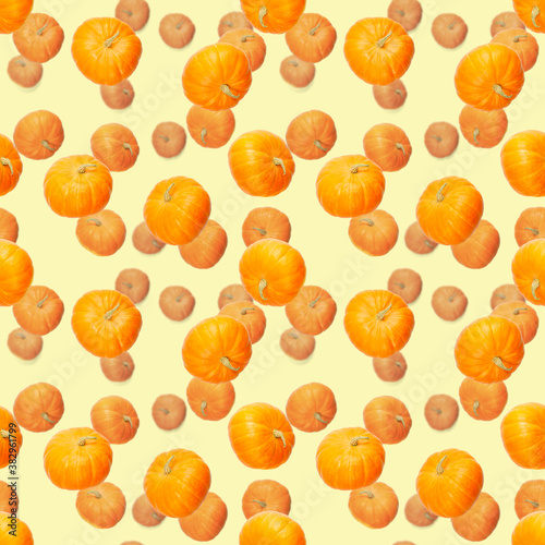 Seamless pattern with pumpkin. Autumn abstract seamless pattern made from Pumpkins on the yellow background. Pumpkin quality pattern.