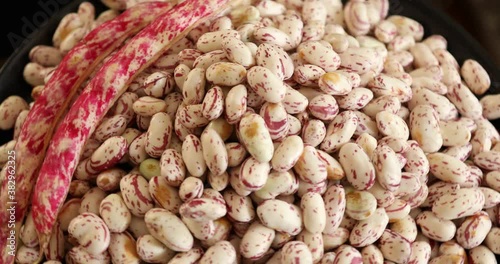 A pile of raw fresh kidney beans rotating