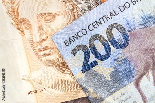 Dinheiro, Brasil, Real, Reais. A brazilian banknotes in close-up. Banknote of 200 Reais and 50 Reais.	 photo