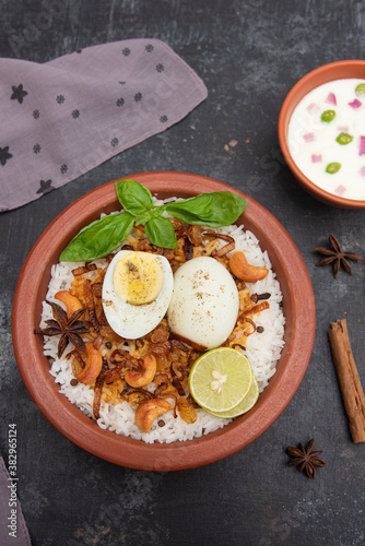 Egg biryani. Spicy Indian Malabar biryani or Hydrabadi biryani, Dum Biriyani,  fish and rice. pulao basmati rice, spicy mixed rice dish with meat curry for Ramadan Kareem, Eid