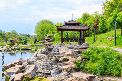 Beautiful japanese gazebo by a pond in Japanese garden