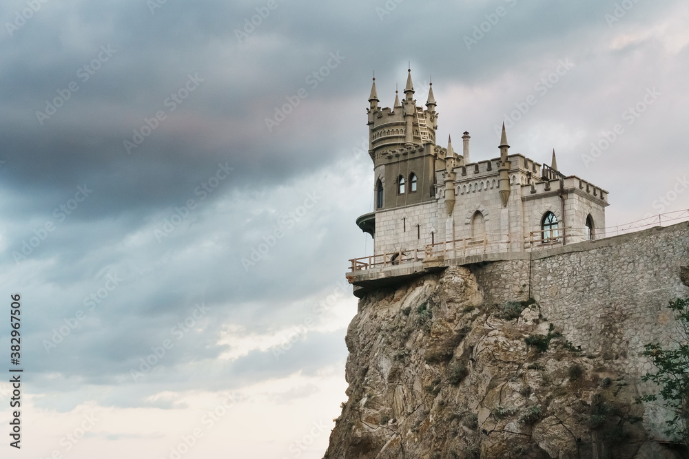 Castle swallow's nest, stands on a rock at the cliff on the background of the black sea.