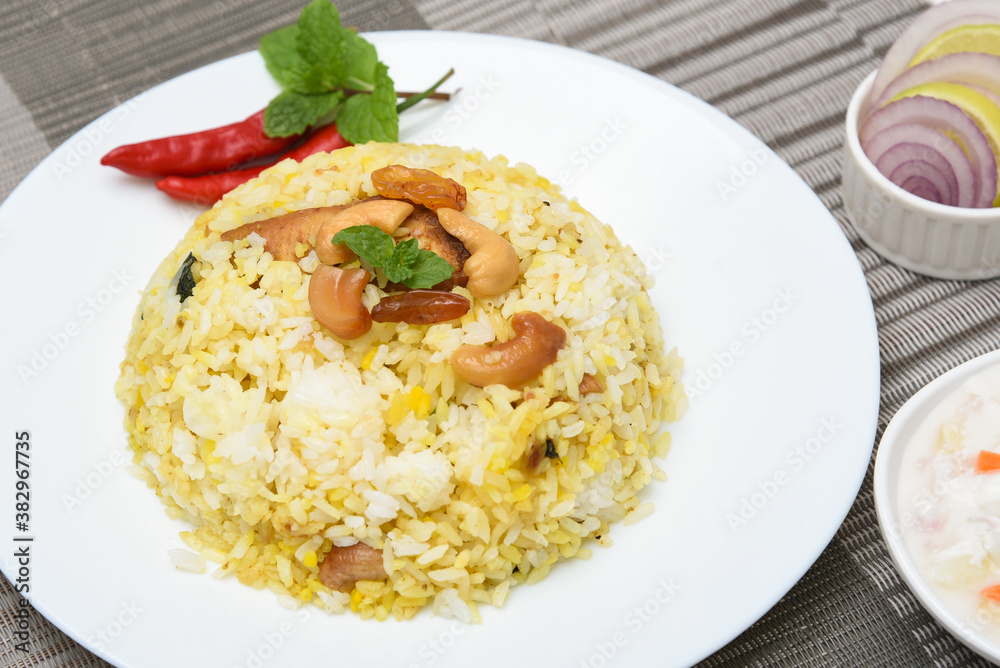 Chicken biryani. Spicy Indian Malabar biryani or Hydrabadi biryani, Dum Biriyani, fish and rice. pulao basmati rice, spicy mixed rice dish with meat curry for Ramadan Kareem, Eid Chicken biryani. Spicy Indian Malabar biryani or Hydrabadi biryani, Dum Biriyani, fish and rice. pulao basmati rice, spicy mixed rice dish with meat curry for Ramadan Kareem, Eid