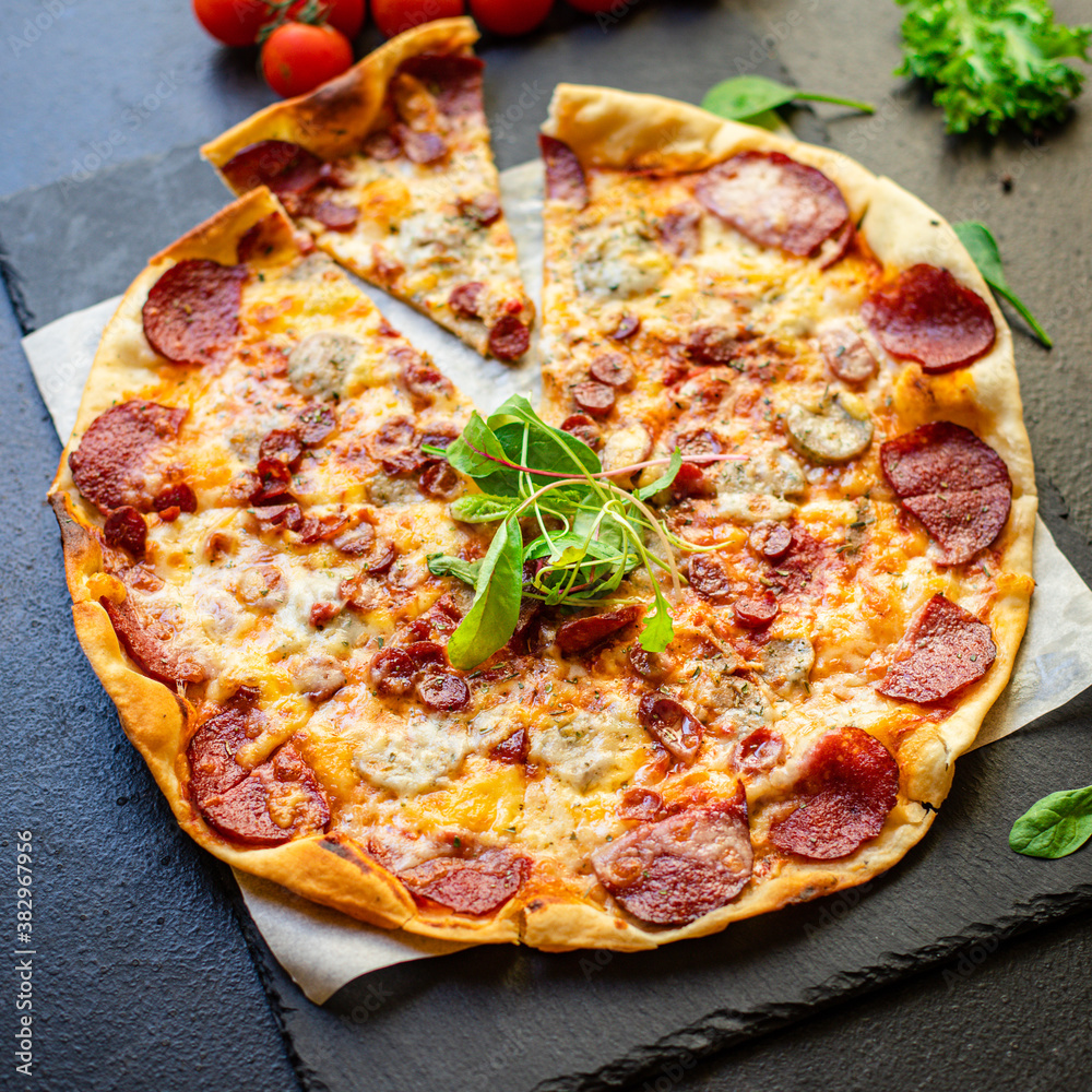 pizza meat salami sausage cheese tomato sauce
serving size fast food top view place copy space for text food background rustic 