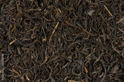 Dried tea leaves background texture. close-up