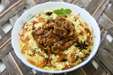 beef or Mutton or lamb biryani. Spicy Indian Malabar biryani or Hydrabadi biryani, Dum Biriyani,  fish and rice. pulao basmati rice, spicy mixed rice dish with meat curry for Ramadan Kareem, Eid